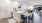 Model kitchen at our apartments for rent in Boulder, CO, featuring wood grain floor paneling and stainless steel appliances.